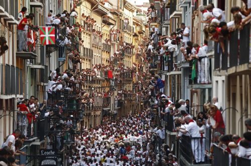 LA Times – People on Rooftops People on balconies looking down at the running. Photo from LA Times.